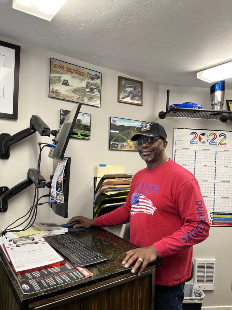 Smiling Durango Automotive Repair employee