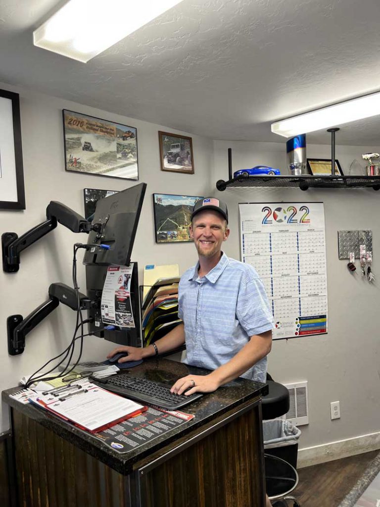 Smiling Durango Automotive Repair employee