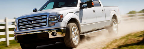 Truck driving on dirt road